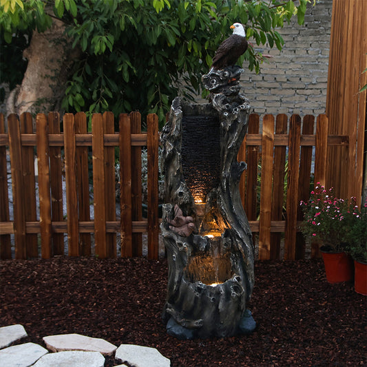 FountJoy Bald Eagle Rainforest Tree Trunk Water Fountain with Warm LED Lights - Soft Illumination Highlighting Eagle and Rainforest Details - Nighttime Backyard Landscape Centerpiece