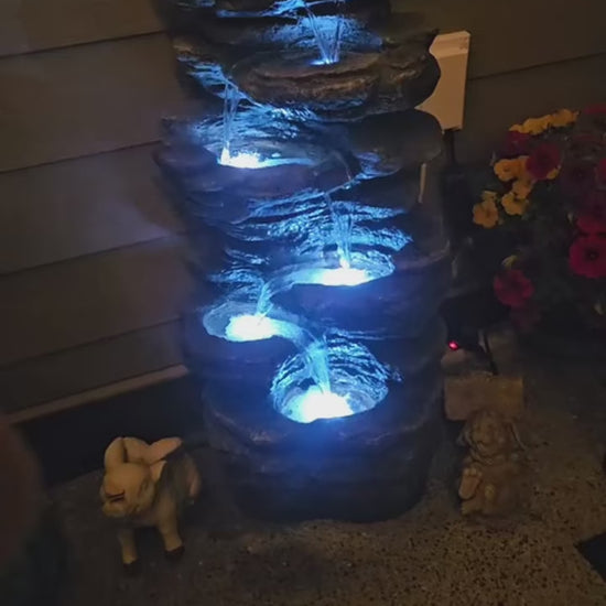 FountJoy 3-Tier Rock Waterfall LED Outdoor Water Fountain featuring natural stone-textured design with multi-level cascading water flow. Integrated LED lighting enhances the waterfall effect, perfect as a backyard fountain or garden yard decoration.