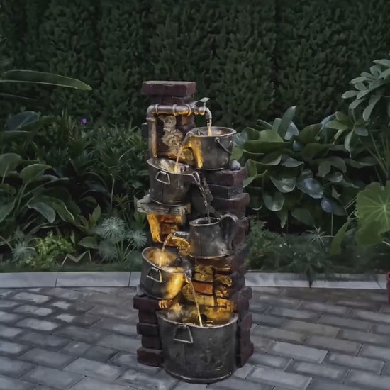FountJoy rustic rock fountain evoking the serenity of a woodland stream right in your backyard. Warm LED lights dance across cascading water between weathered stone tiers — a cozy garden centerpiece for relaxing outdoor evenings.