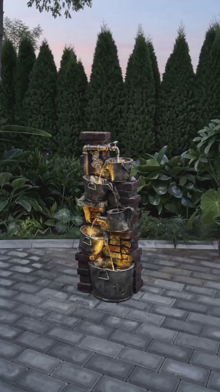 FountJoy rustic rock fountain evoking the serenity of a woodland stream right in your backyard. Warm LED lights dance across cascading water between weathered stone tiers — a cozy garden centerpiece for relaxing outdoor evenings.