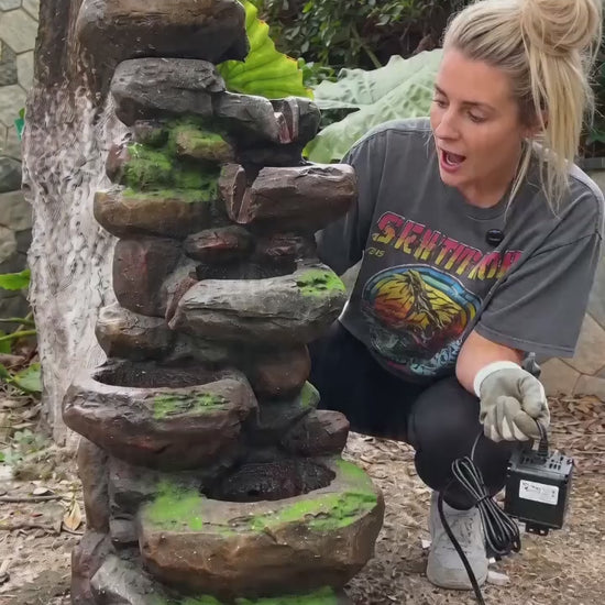 FountJoy rock waterfall fountain recreating the beauty of nature in your own garden. Listen to water tumbling over layered stone tiers as LED lights cast a warm glow — transform your patio into a peaceful retreat with this outdoor water feature.